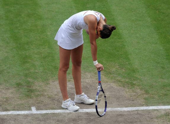 Lawn Tennis - 2021 All England Championships - Woman™s Final - Wimbledon Ashleigh Barty v Karolina Pliskova Karolina Pliskova shows her dissapointment after losing her serve 