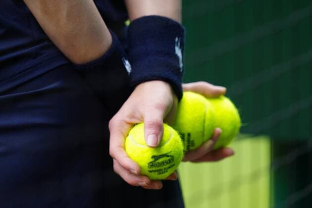 Mandatory Credit: Photo by Shutterstock (12203622ea) Ball Boy with tennis balls Wimbledon Tennis Championships, Day 12, The All England Lawn Tennis and Croquet Club, London, UK - 10 Jul 2021 Wimbledon Tennis Championships, Day 12, The All England Lawn Tennis and Croquet Club, London, UK - 10 Jul 2021  Copyright: xShutterstockx 12203622ea