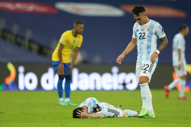 10th July 2021, Est& xe1;dio do Maracan& xe3;, Rio de Janeiro, Brazil. Copa America tournament final, Argentina versus Brazil; Lionel Messi of Argentina, goes down from contact and is checked by Lautaro Mart& xed;nez of Argentina  ActionPlus12304503 HeulerxAndrey
