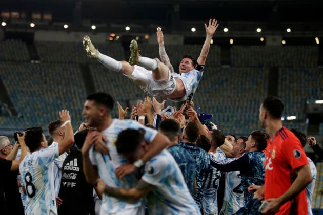 (210711) -- RIO DE JANEIRO, July 11, 2021 -- Argentina s Lionel Messi is thrown into the air by teammates after winning 2021 Copa America football tournament final match against Brazil in Rio de Janeiro, Brazil, on July 10, 2021. (Photo by Lucio Tavora Xinhua) (SP)BRAZIL-RIO DE JANEIRO-COPA AMERICA-FINAL LuxXiao¡¤tawola 