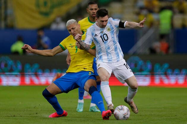 (210711) -- RIO DE JANEIRO, July 11, 2021 -- Argentina s Lionel Messi (R) vies with Brazil s Richarlison (L) during 2021 Copa America football tournament final match in Rio de Janeiro, Brazil, on July 10, 2021. (Photo by Lucio Tavora Xinhua) (SP)BRAZIL-RIO DE JANEIRO-COPA AMERICA-FINAL LuxXiao¡¤tawola 