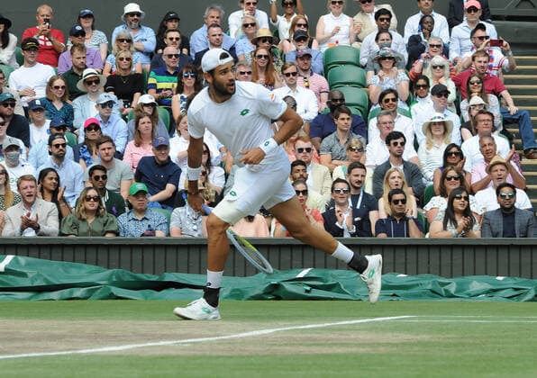 Lawn Tennis - 2021 All England Championships - Men™s Final Sunday - Wimbledon Novak Djokovic v Matteo Berrettini on centre Court Matteo Berrettini hot dog™s Novak to win the point 