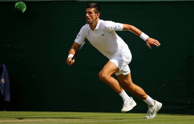 Mandatory Credit: Photo by Shutterstock (12204580c) Novak Djokovic of Serbia in action Wimbledon Tennis Championships, Day 13, The All England Lawn Tennis and Croquet Club, London, UK - 11 Jul 2021 Wimbledon Tennis Championships, Day 13, The All England Lawn Tennis and Croquet Club, London, UK - 11 Jul 2021  Copyright: xShutterstockx 12204580c