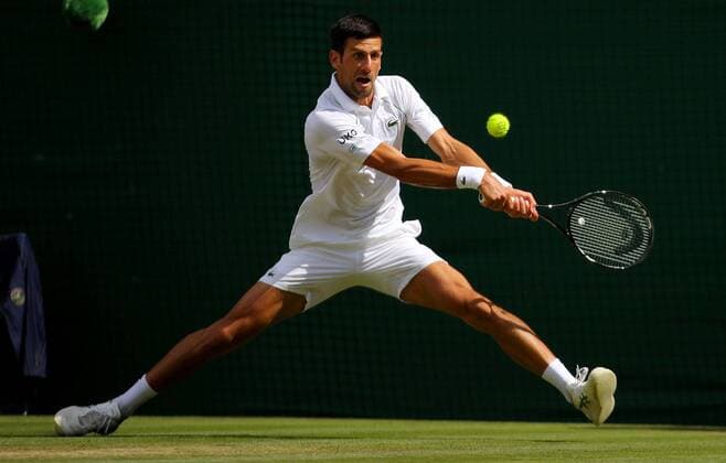 Mandatory Credit: Photo by Shutterstock (12204580a) Novak Djokovic of Serbia in action Wimbledon Tennis Championships, Day 13, The All England Lawn Tennis and Croquet Club, London, UK - 11 Jul 2021 Wimbledon Tennis Championships, Day 13, The All England Lawn Tennis and Croquet Club, London, UK - 11 Jul 2021  Copyright: xShutterstockx 12204580a