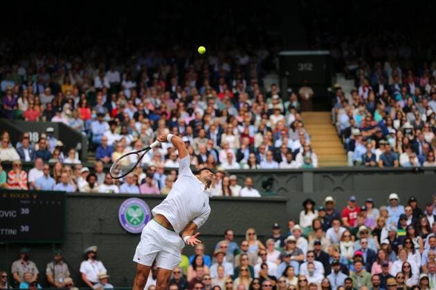 Mandatory Credit: Photo by Shutterstock (12204580w) Novak Djokovic of Serbia in action Wimbledon Tennis Championships, Day 13, The All England Lawn Tennis and Croquet Club, London, UK - 11 Jul 2021 Wimbledon Tennis Championships, Day 13, The All England Lawn Tennis and Croquet Club, London, UK - 11 Jul 2021  Copyright: xShutterstockx 12204580w
