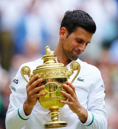 Mandatory Credit: Photo by Javier Garcia Shutterstock (12204578fs) Novak Djokovic celebrates with the trophy after victory in the Gentlemen s Singles final Wimbledon Tennis Championships, Day 13, The All England Lawn Tennis and Croquet Club, London, UK - 11 Jul 2021 Wimbledon Tennis Championships, Day 13, The All England Lawn Tennis and Croquet Club, London, UK - 11 Jul 2021  Copyright: xJavierxGarcia Shutterstockx 12204578fs