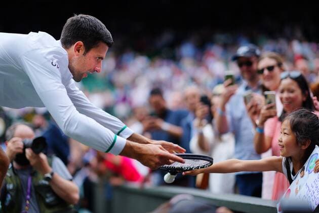 Tennis, Wimbledon, final, winner Novak Djokovic gives his racket to fan