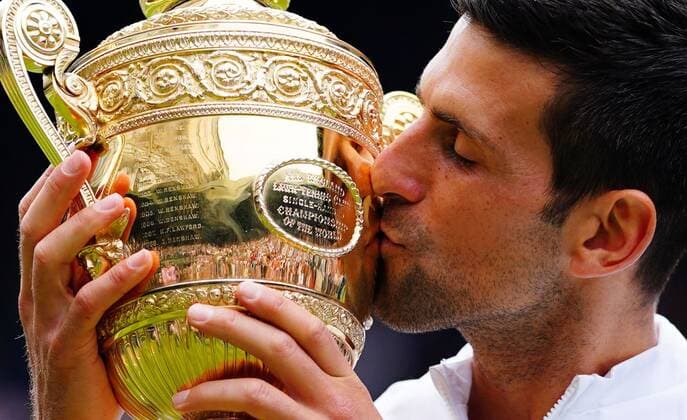Mandatory Credit: Photo by Javier Garcia Shutterstock (12204578gd) Novak Djokovic celebrates with the trophy after victory in the Gentlemen s Singles final Wimbledon Tennis Championships, Day 13, The All England Lawn Tennis and Croquet Club, London, UK - 11 Jul 2021 Wimbledon Tennis Championships, Day 13, The All England Lawn Tennis and Croquet Club, London, UK - 11 Jul 2021  Copyright: xJavierxGarcia Shutterstockx 12204578gd