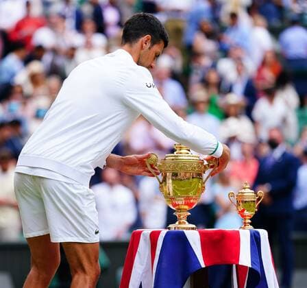 Mandatory Credit: Photo by Javier Garcia Shutterstock (12204578gt) Novak Djokovic places the trophy back on the table after victory in the Gentlemen s Singles final Wimbledon Tennis Championships, Day 13, The All England Lawn Tennis and Croquet Club, London, UK - 11 Jul 2021 Wimbledon Tennis Championships, Day 13, The All England Lawn Tennis and Croquet Club, London, UK - 11 Jul 2021  Copyright: xJavierxGarcia Shutterstockx 12204578gt