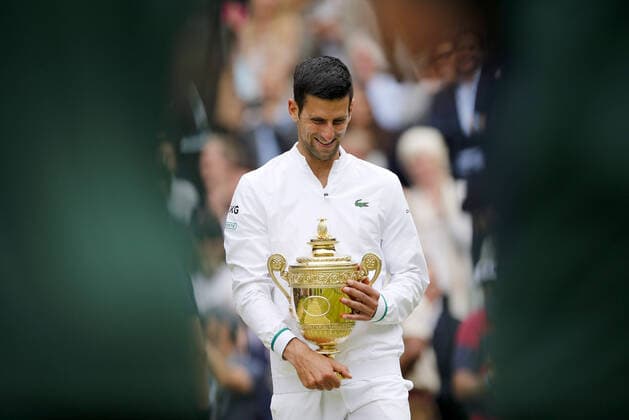 Mandatory Credit: Photo by Shutterstock (12204580ac) Novak Djokovic of Serbia celebrates with the trophy Wimbledon Tennis Championships, Day 13, The All England Lawn Tennis and Croquet Club, London, UK - 11 Jul 2021 Wimbledon Tennis Championships, Day 13, The All England Lawn Tennis and Croquet Club, London, UK - 11 Jul 2021  Copyright: xShutterstockx 12204580ac