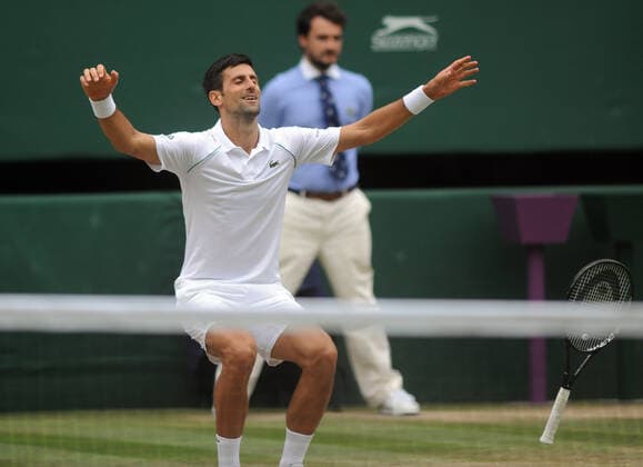 Lawn Tennis - 2021 All England Championships - Men™s Final Sunday - Wimbledon - Novak Djokovic v Matteo Berrettini on Centre Court Novak Djokovic celebrates winning match point 