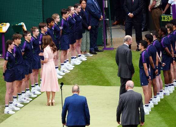 Mandatory Credit: Photo by Shutterstock (12204579fe) Catherine Duchess of Cambridge chatting with ballboys and ball girls on Centre Court before the trophy presentation Wimbledon Tennis Championships, Day 13, The All England Lawn Tennis and Croquet Club, London, UK - 11 Jul 2021 Wimbledon Tennis Championships, Day 13, The All England Lawn Tennis and Croquet Club, London, UK - 11 Jul 2021  Copyright: xShutterstockx 12204579fe