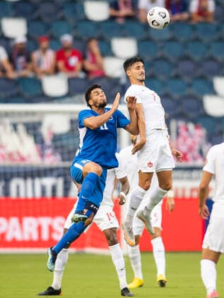 KANSAS CITY, KS - JULY 11: Canada midfielder Stephen Eustaquio (7) and Martinique forward Emmanuel Riviere (11) go up for a header during the CONCACAF Gold Cup match between Canada and Martinique on Sunday, July 11, 2021 at Children™s Mercy park in Kansas City, KS. (Photo by Nick Tre. Smith Icon Sportswire) SOCCER: JUL 11 Concacaf Gold Cup - Canada v Martinique Icon2107110034