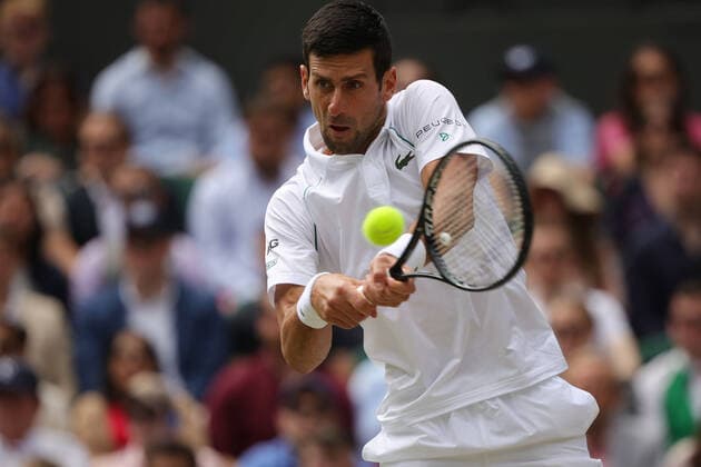 (210712) -- LONDON, July 12, 2021 -- Novak Djokovic of Serbia hits a return during the men s final match between Novak Djokovic of Serbia and Matteo Berrettini of Italy at Wimbledon tennis Championship in London, Britain, on July 11, 2021. (Photo by Xinhua) (SP)BRITAIN-LONDON-TENNIS-WIMBLEDON-MEN S FINAL TimxIreland 