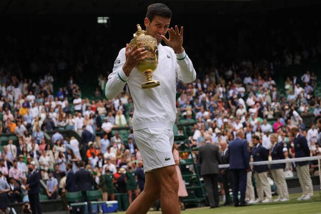 (210712) -- LONDON, July 12, 2021 -- Novak Djokovic of Serbia celebrates with the trophy after winning the men s final match between Novak Djokovic of Serbia and Matteo Berrettini of Italy at Wimbledon tennis Championship in London, Britain, on July 11, 2021. (Photo by Xinhua) (SP)BRITAIN-LONDON-TENNIS-WIMBLEDON-MEN S FINAL TimxIreland 