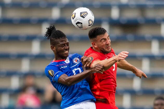 KANSAS CITY, KS - JULY 15: Haiti midfielder Leverton Pierre (14) and Canada forward Lucas Cavallini (9) go up for a header during the CONCACAF Gold Cup match between Canada and Haiti on Thursday July 15, 2021 at ChildrenÕs Mercy Park in Kansas City, KS. (Photo by Nick Tre. Smith Icon Sportswire) SOCCER: JUL 15 Concacaf Gold Cup - Haiti v Canada Icon21071528