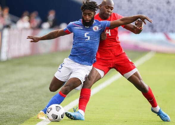 KANSAS CITY, KS - JULY 15: Haiti defender Stephane Lambese (5) works against Canada defender Kamal Miller (4) in the second half of a Concacaf Gold Cup match between Haiti and Canada on Jul 15, 2021 at Children s Mercy Park in Kansas City, KS. (Photo by Scott Winters Icon Sportswire) SOCCER: JUL 15 Concacaf Gold Cup - Haiti v Canada Icon2107150152