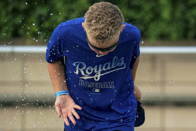 A child playes in the waterpark before the Kansas City Royals take on the Baltimore Orioles at Kaufman Stadium in Kansas City, Missouri on Friday, July 16, 2021.  KCP20210716106 KYLExRIVAS