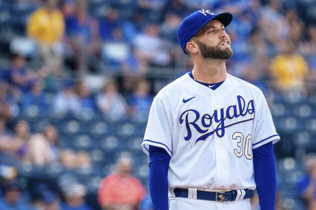 Kansas City Royals starting pitcher Danny Duffy (30) reacts to the stadiums lights turning on just before the first pitch against the Baltimore Orioles at Kaufman Stadium in Kansas City, Missouri on Friday, July 16, 2021.  KCP20210716107 KYLExRIVAS