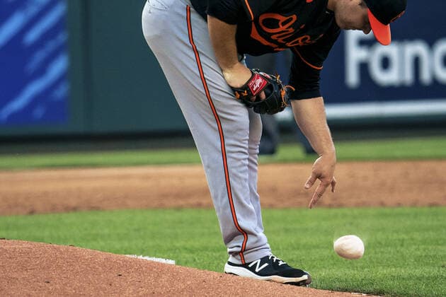 Baltimore Orioles starting pitcher Keegan Akin (45) tosses a rosin bag down after allowing four runs in the first two innings against the Kansas City Royals at Kaufman Stadium in Kansas City, Missouri on Friday, July 16, 2021.  KCP20210716119 KYLExRIVAS