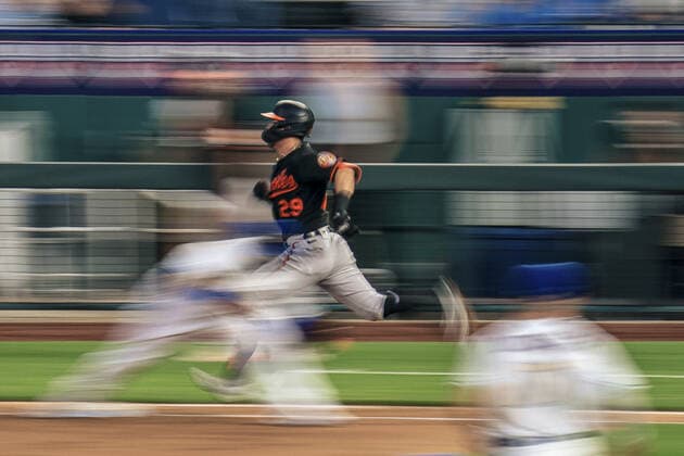 Baltimore Orioles shortstop Ramon Urias (29) attempts to beat the Kansas City Royals throw to first in the fifth inning at Kaufman Stadium in Kansas City, Missouri on Friday, July 16, 2021.  KCP20210716128 KYLExRIVAS