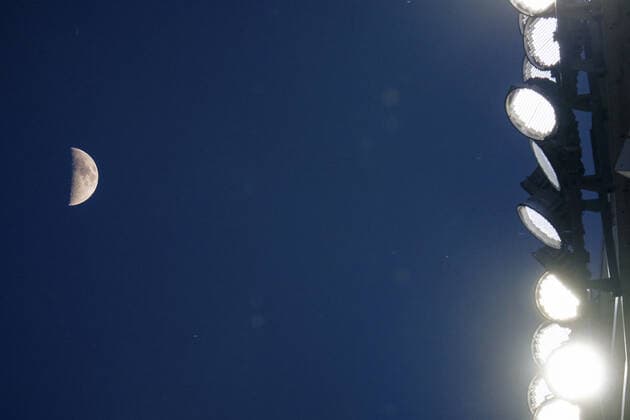 The moon shines over the stadium as the Kansas City Royals take on the Baltimore Orioles at Kaufman Stadium in Kansas City, Missouri on Friday, July 16, 2021.  KCP20210716129 KYLExRIVAS