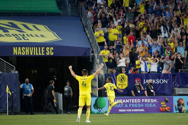 NASHVILLE, TN - JULY 08: Nashville SC midfielder Hany Mukhtar (10) runs to the sideline to celebrate a first half hat trick as Nashville SC defender Dave Romney (4) raises his arms in celebration during a match between Nashville SC and Chicago Fire, July 17, 2021, at Nissan Stadium in Nashville, Tennessee. (Photo by Matthew Maxey Icon Sportswire) SOCCER: JUL 17 MLS, Fussball Herren, USA - Chicago Fire FC at Nashville SC Icon21071703