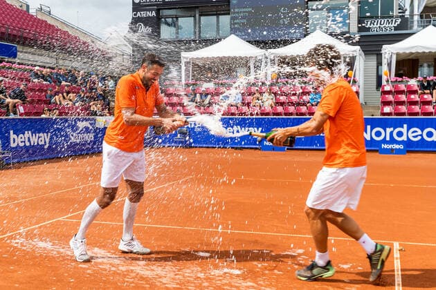 210718 Sander Arends, The Netherlands, and David Pel, The Netherlands, cheer and splash champagne after winning the doubles final on day 14 of the Nordea Open on 18 July 2021 in Bastad,  Copyright: MATHILDAxAHLBERG BB210718BB342