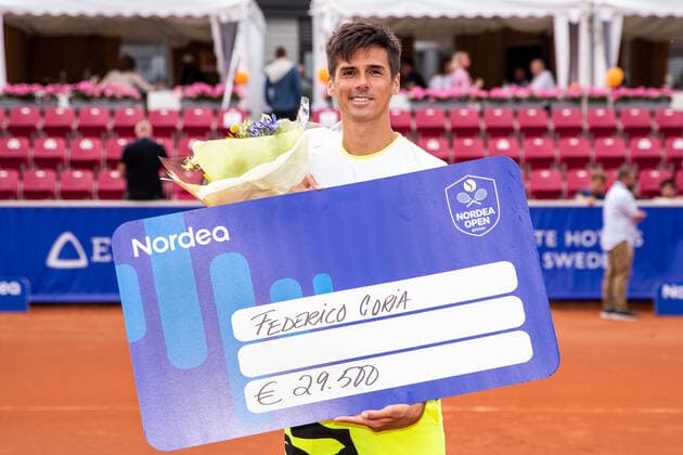 210718 Federico Coria, Argentina, with his prize check after finishing second in the singles tournament on day 14 of the Nordea Open on 18 July 2021 in Bastad,  Copyright: MATHILDAxAHLBERG BB210718BB562