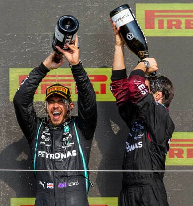 18th July 2021; Silverstone Circuit, Silverstone, Northamptonshire, England; Formula One British Grand Prix, Race Day; Mercedes AMG Petronas F1 Team driver Lewis Hamilton and a team member pour the champagne over themselves  ActionPlus12307247 TimxWilliams