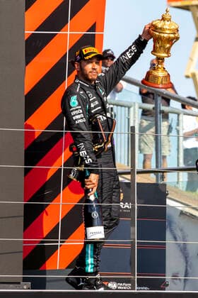 18th July 2021; Silverstone Circuit, Silverstone, Northamptonshire, England; Formula One British Grand Prix, Race Day; Mercedes AMG Petronas F1 Team driver Lewis Hamilton leaves the podium with the winners trophy  ActionPlus12307250 TimxWilliams