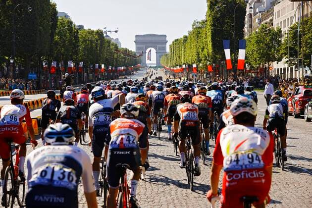 PARIS, FRANCE - JULY 18 : Peloton at the Arc de Triomphe during stage 21 of the 108th edition of the 2021 Tour de France cycling race, the stage of 108,4 kms between Chatou and finish at the Champs Elysees in Paris. on July 18, 2021 in Paris, France, 18 07 2021 CYCLISME : Tour de France 2021 - Etape 21 - Chatou to Champs Elysees - 18 07 2021 PHOTONEWS PANORAMIC 