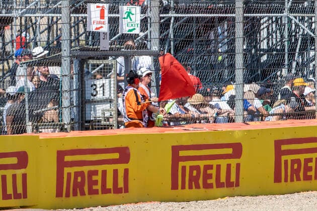 18th July 2021; Silverstone Circuit, Silverstone, Northamptonshire, England; Formula One British Grand Prix, Race Day; The red flag is waved to stop the race after a crash between Red Bull Racing Honda driver Max Verstappen and Mercedes AMG Petronas F1 Team driver Lewis Hamilton  ActionPlus12307284 TimxWilliams
