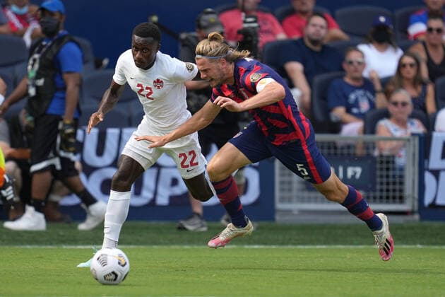 KANSAS CITY, KS - JULY 18: United States defender Walker Zimmerman (5) battles with Canada defender Richie Laryea (22) in action during the CONCACAF Gold Cup Group B match between the United States and Canada on July 18, 2021 at Children s Mercy Park in Kansas City, KS. (Photo by Robin Alam Icon Sportswire) SOCCER: JUL 18 Concacaf Gold Cup - USA v Canada Icon164210718013