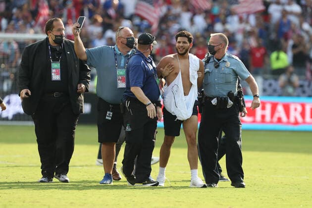 KANSAS CITY, KS - JULY 18: Security handcuffs and removes a fan who ran onto the field after a Concacaf Gold Cup match between Canada and the United States on Jul 18, 2021 at Children s Mercy Park in Kansas City, KS. (Photo by Scott Winters Icon Sportswire) SOCCER: JUL 18 Concacaf Gold Cup - USA v Canada Icon2107180250