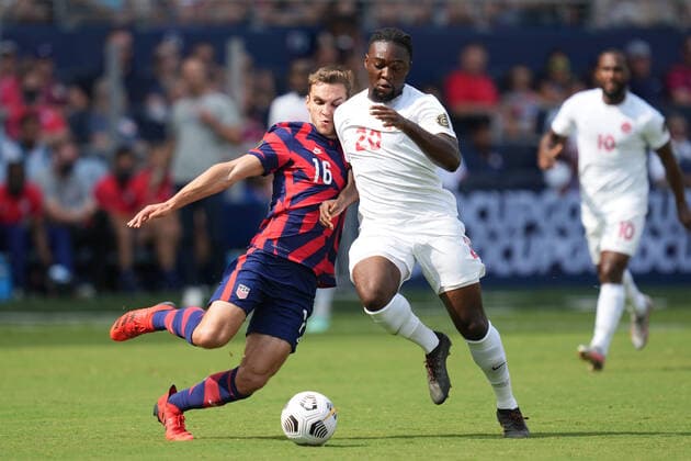 KANSAS CITY, KS - JULY 18: United States defender James Sands (16) battles with Canada forward Ayo Akinola (20) in action during the CONCACAF Gold Cup Group B match between the United States and Canada on July 18, 2021 at Children s Mercy Park in Kansas City, KS. (Photo by Robin Alam Icon Sportswire) SOCCER: JUL 18 Concacaf Gold Cup - USA v Canada Icon164210718030