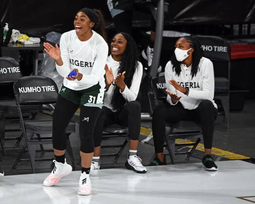 July 18, 2021 - Las Vegas, Nevada, U.S. - (L-R) Nigerian players and sisters Erica Erinma Ogwumike, Chiney Ogwumike and Nneka Ogwumike applaud their team during a pre-Olympic exhibition basketball game July 18, 2021, in Las Vegas. Las Vegas USA - ZUMAbk3_ 20210718_zaf_bk3_019 Copyright: xDavidxBeckerx