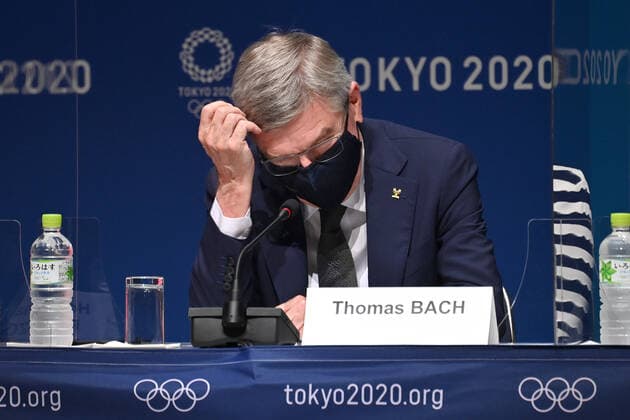 IOC President Dr Thomas BACH in front of the logo Tokyo 2020 and the Olympic rings Wearing mouth guard,mask gesture,skeptical,single image,cropped single image,portrait,portrait,IOC press conference on 21 07 2021 Summer Olympics 2020, from 23 07 08 2021 in Tokyo Japan