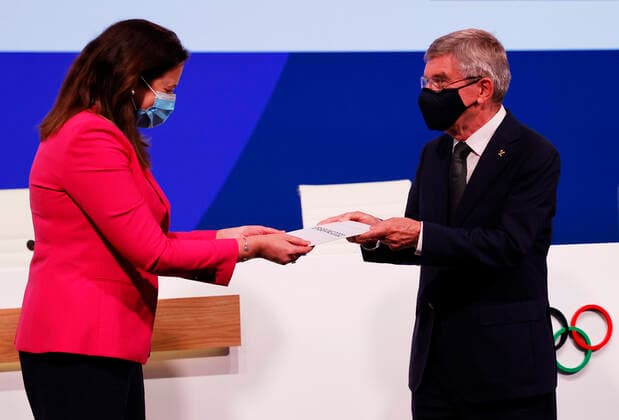 (210721) -- TOKYO, July 21, 2021 -- International Olympic Committee Thomas Bach (R) presents the Honourable Annastacia Palaszczuk MP, Premier of Queensland and Minister for Trade, with a card after Brisbane was announced as the 2032 Summer Olympics host city during the 138th International Olympic Committee (IOC) Session in Tokyo, Japan, on July 21, 2021. ( Pool via Xinhua) (SP)TOKYO-JAPAN-IOC-138TH SESSION ToruxHanai 