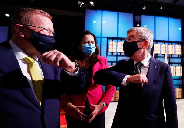 (210721) -- TOKYO, July 21, 2021 -- International Olympic Committee Thomas Bach (R) bumps elbows with members of the Brisbane 2032 delegation John Coates AC (L), President, Australian Olympic Committee and The Honourable Annastacia Palaszczuk MP, Premier of Queensland and Minister for Trade, after Brisbane was announced as the 2032 Summer Olympics host city during the 138th International Olympic Committee (IOC) Session in Tokyo, Japan, on July 21, 2021. ( Pool via Xinhua) (SP)TOKYO-JAPAN-IOC-138TH SESSION ToruxHanai 