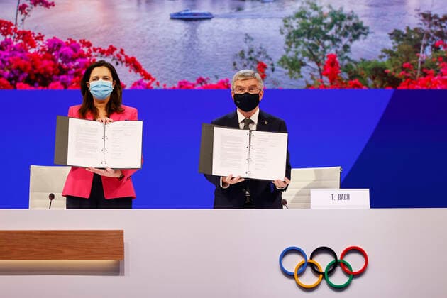 (210721) -- TOKYO, July 21, 2021 -- The Honourable Annastacia Palaszczuk MP, Premier of Queensland and Minister for Trade (L), and President of the International Olympic Committee Thomas Bach hold up copies of the Host Agreement after Brisbane was announced as the 2032 Summer Olympics host city during the 138th International Olympic Committee (IOC) Session in Tokyo, Japan, on July 21, 2021. ( Pool via Xinhua) (SP)TOKYO-JAPAN-IOC-138TH SESSION ToruxHanai 