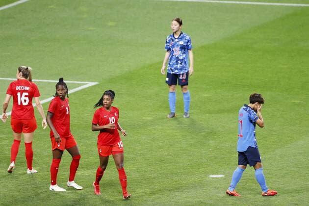 Tokyo Olympics: Football Mina Tanaka (R) of Japan reacts after missing from the penalty spot during the second half of a Group E match of the Tokyo Olympic women s football tournament against Canada on July 21, 2021, at Sapporo Dome in northern Japan.  A14AA0000753390P