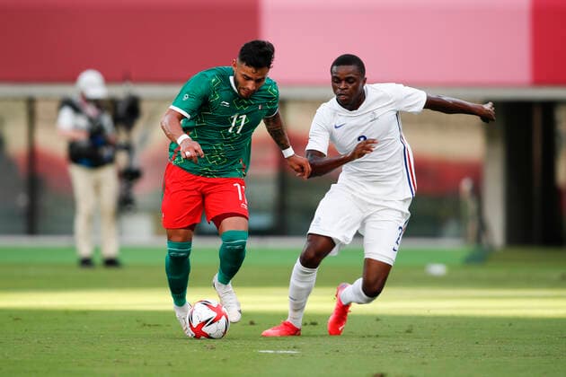 July 22, 2021, Tokyo, Japan: ALEXIS VEGA (11) of Mexico in action against PIERRE KALULU (2) of France during a men s soccer game between Mexico and France at the Tokyo Stadium for the Tokyo 2020, Olympic Games, Olympische Spiele, Olympia, OS Mexico won the match 4-1. Tokyo Japan - ZUMAm191 20210722_zap_m191_002 Copyright: xRodrigoxReyesxMarinx