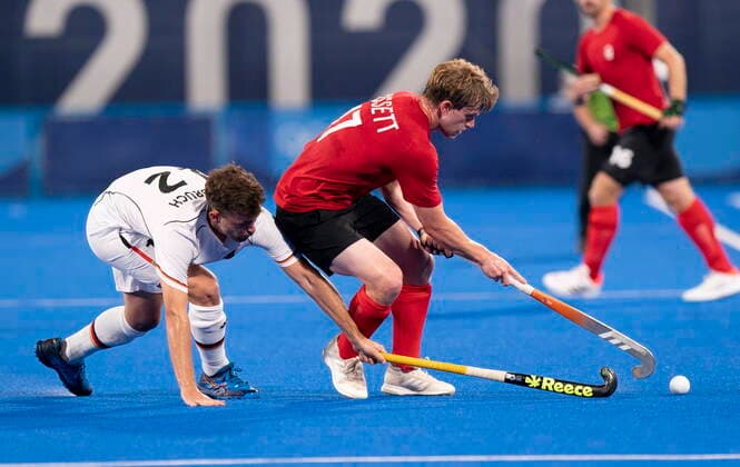 July 24, 2021, Tokyo, Japan: CanadaÃ¢â‚¬â ¢s Brenden Bissett controls the ball under pressure from GermanyÃ¢â‚¬â ¢s Tim Herzbruch during first half Field hockey, Feldhockey action at the Tokyo Olympics, Saturday, July 24, 2021 in Tokyo, Japan. Brenden Bissett Tim Herzbruch  - ZUMAc35_ 20210724_zaf_c35_069 Copyright: xAdrianxWyldx