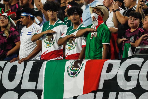 GLENDALE, AZ - JULY 24: Young Mexico fans salute during the Mexican National Anthem before the Concacaf Gold Cup quarterfinal soccer game between Mexico and Honduras on July 24, 2021 at State Farm Stadium in Glendale, Arizona. (Photo by Kevin Abele Icon Sportswire) SOCCER: JUL 24 Concacaf Gold Cup Quarterfinal - Mexico v Honduras Icon210724014