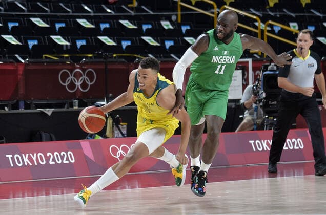 Australia s Dante Exum (L) dribbles past Nigeria s Obi Emegano during Men s Basketball game at the Tokyo 2020 Olympics, Sunday, July 25, 2021, in Tokyo, Japan.  OLY20210725816 MIKExTHEILER