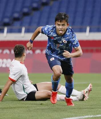 Tokyo Olympics: Football Japan s Takefusa Kubo reacts after opening the scoring against Mexico during the first half of their Group A men s football match of the Tokyo Olympics on July 25, 2021, at Saitama Stadium in Saitama, eastern Japan. (SELECTION)  A14AA0000754347P