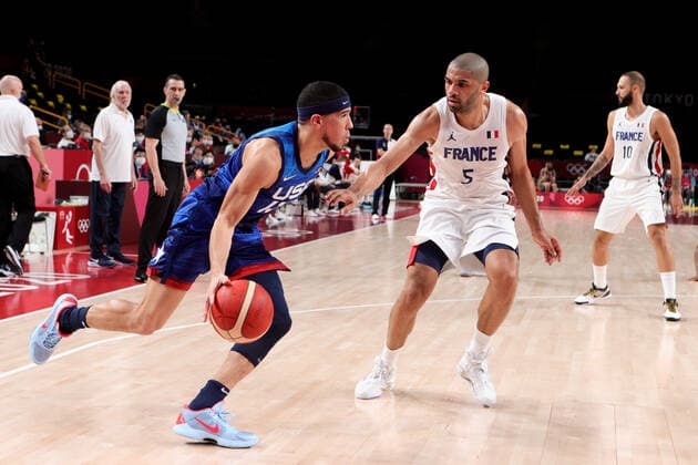 TOKYO, JAPAN - JULY 25: Devin Booker of Team United States controls the ball during the Men s Basketball Preliminary Round Group A - Match 4 between France and USA on Day 2 of the Tokyo 2020 Olympic Games, Olympische Spiele, Olympia, OS at Saitama Super Arena on July 25, 2021 in Tokyo, Japan. (Photo by Pete Dovgan Speed Media Icon Sportswire) OLYMPICS: JUL 25 Olympics Tokyo 2020 Icon2107250250