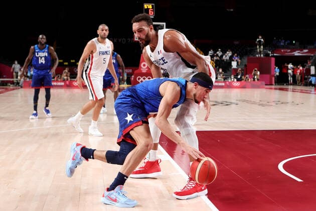 TOKYO, JAPAN - JULY 25: Devin Booker of Team United States tries to get past Rudy Gobert of Team France during the Men s Basketball Preliminary Round Group A - Match 4 between France and USA on Day 2 of the Tokyo 2020 Olympic Games, Olympische Spiele, Olympia, OS at Saitama Super Arena on July 25, 2021 in Tokyo, Japan. (Photo by Pete Dovgan Speed Media Icon Sportswire) OLYMPICS: JUL 25 Olympics Tokyo 2020 Icon2107250253