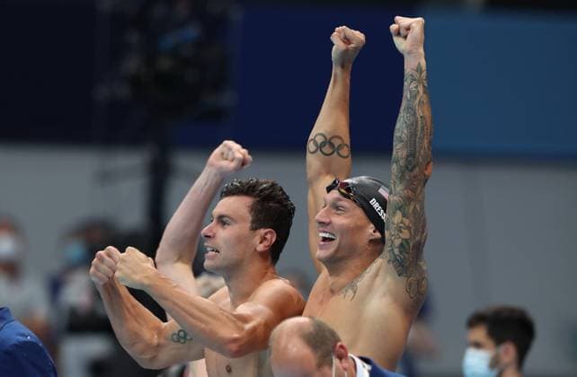 (210726) -- TOKYO, July 26, 2021 -- Blake Pieroni (L) and Caeleb Dressel of the United States celebrate after men s 4x100m freestyle relay final at the Tokyo 2020 Olympic Games, Olympische Spiele, Olympia, OS in Tokyo, Japan, on July 26, 2021. ) (TOKYO2020)JAPAN-TOKYO-OLY-SWIMMING-MEN S-4X100M FREESTYLE RELAY-FINAL DingxXu 